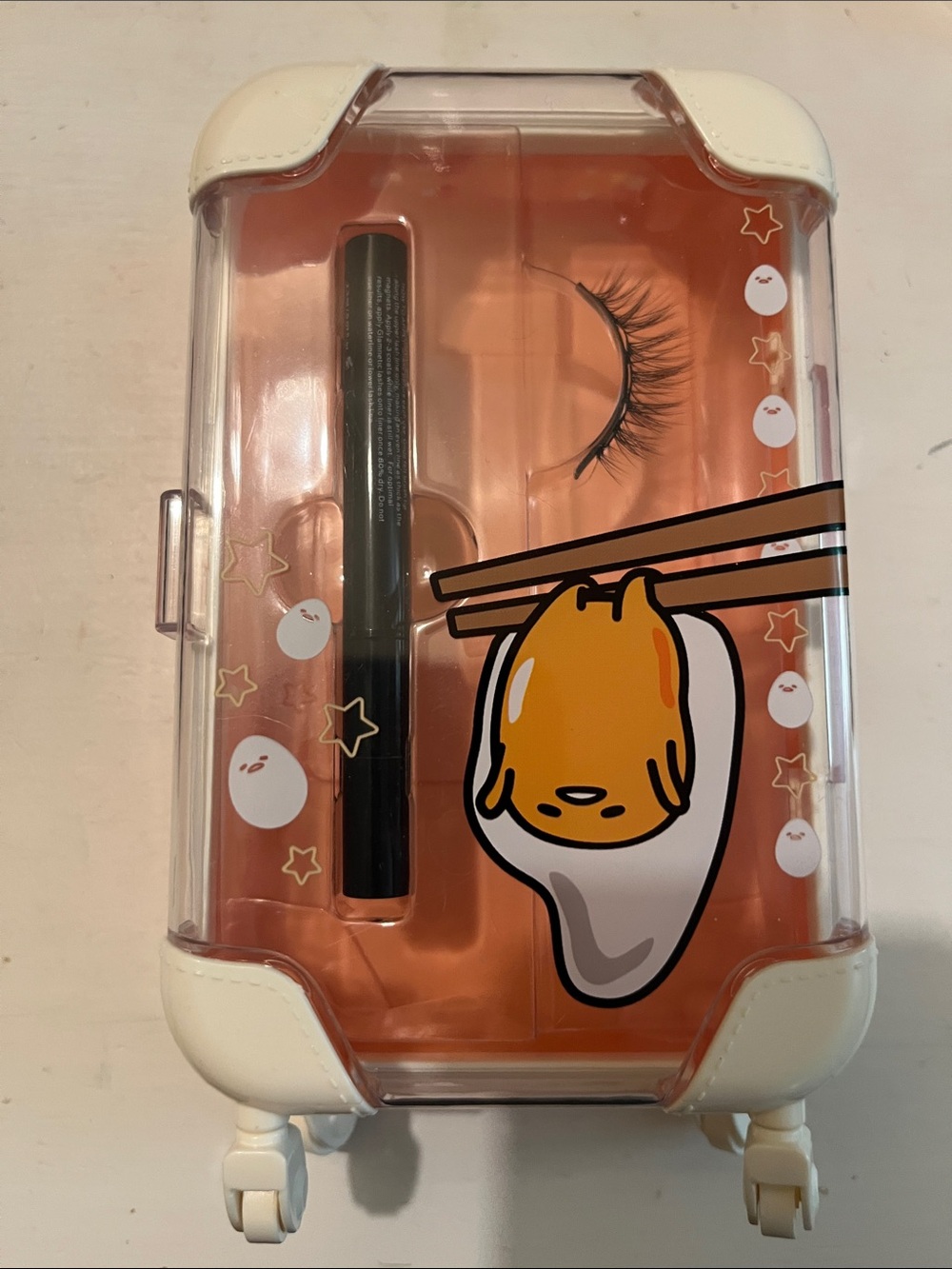 Glamnetic x Hello Kitty Gudetama Luggage Makeup Case with Lashes & Eyeliner